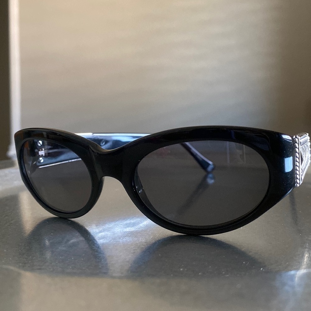 Sunglasses with basket weave metal trim on sides.